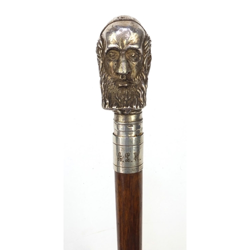 73 - Mahogany walking stick with silver topped Cardinals head, marked 'Sterling', 90cm long