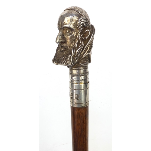 73 - Mahogany walking stick with silver topped Cardinals head, marked 'Sterling', 90cm long