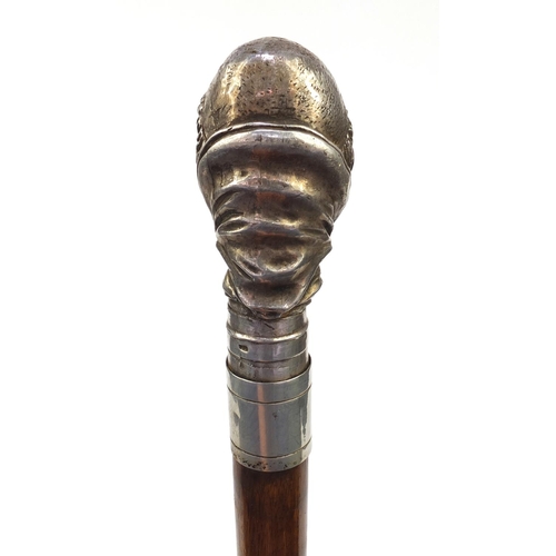 73 - Mahogany walking stick with silver topped Cardinals head, marked 'Sterling', 90cm long