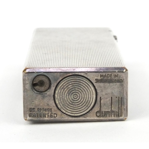 123 - Boxed silver coloured metal Dunhill lighter with engine turned decoration, 6.5cm high