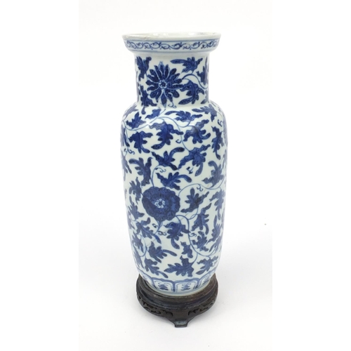 542 - Oriental Chinese porcelain vase hand painted with a continuous band of flowers, raised on a wooden b... 