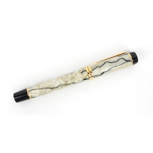 134 - Boxed Parker Duofold cream and black marbleised fountain pen with 18ct gold nib, the pen 14cm long