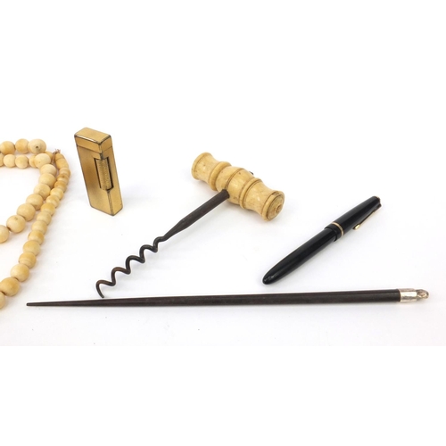 140 - Bag of objects including box wood rules, bone handled corkscrew, ivory beaded necklace, gold plated ... 