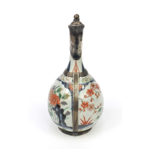 589 - Oriental Japanese Arita lidded jug with unmarked silver mount, 23cm high