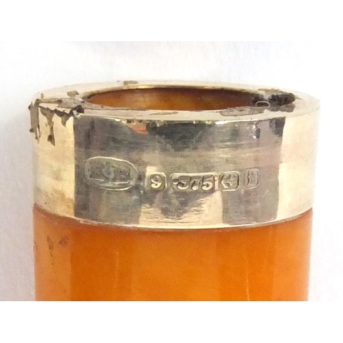 119 - Amber cheroot with 9ct gold mount and silver case, hallmarked Birmingham 1907