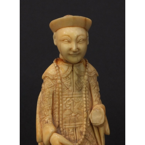 614 - Pair of oriental Chinese carved ivory figures of seated elders, the larger 8.5cm high