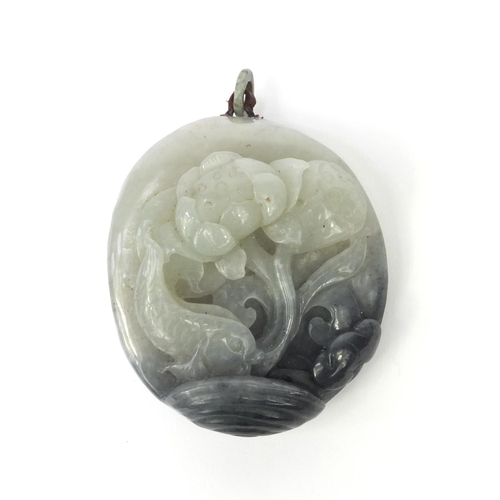 637 - Oriental Chinese jade pendant carved with a fish swimming amongst foliage, 7cm high