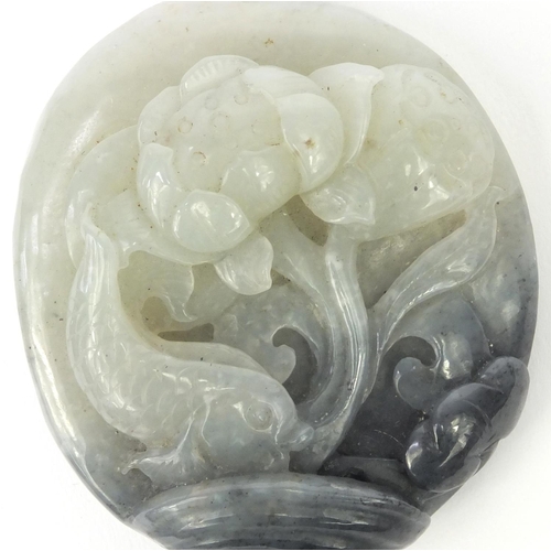 637 - Oriental Chinese jade pendant carved with a fish swimming amongst foliage, 7cm high