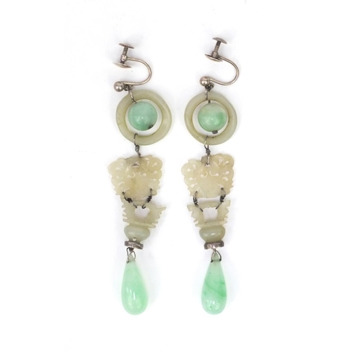 635 - Pair of oriental Chinese carved green jade drop earrings, each 9cm high