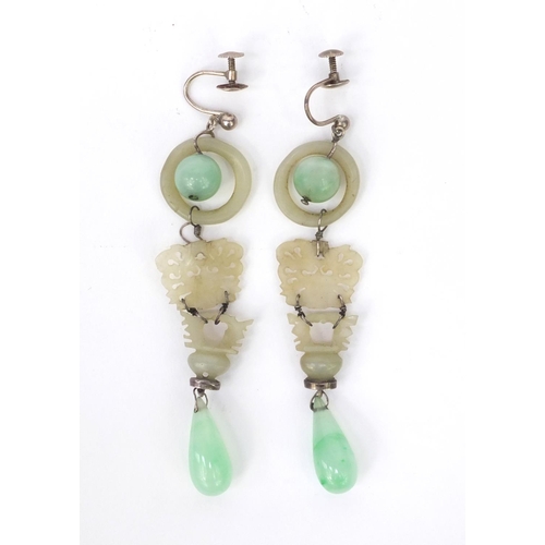 635 - Pair of oriental Chinese carved green jade drop earrings, each 9cm high