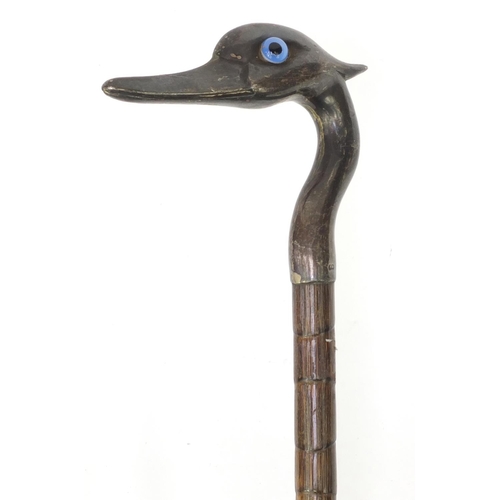 79 - Bamboo parasol with silver top in the form of a bird, with beaded eyes, London 1896, 91cm long