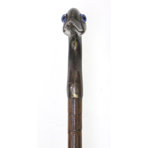 79 - Bamboo parasol with silver top in the form of a bird, with beaded eyes, London 1896, 91cm long