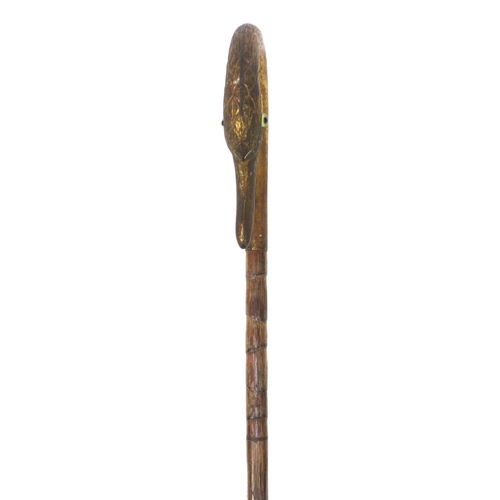 83 - Bamboo parasol with gilt brass top in the form of a swan, with beaded eyes, 91cm long