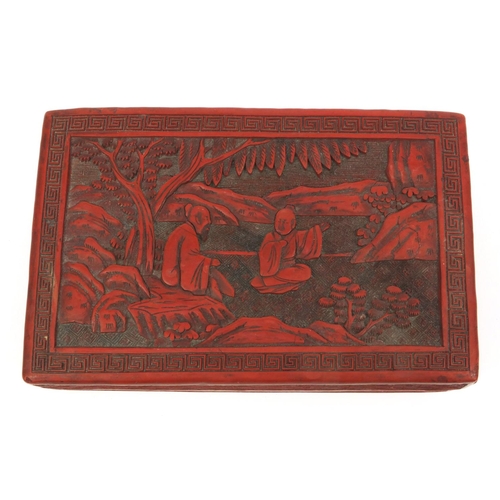 650 - Oriental Chinese cinnabar lacquer box and cover carved with figures, 19cm wide