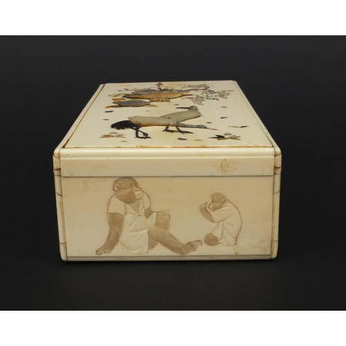 596 - Oriental Japanese ivory Shibayama box and cover, the side carved with monkeys, the top inlaid with a... 