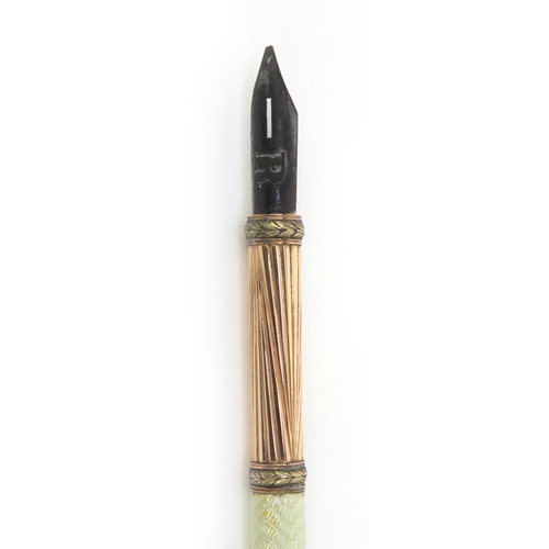 129 - Russian Faberge 14ct and green guilloche enamelled dip pen marked '56', indistinct initials 'R?', 18... 