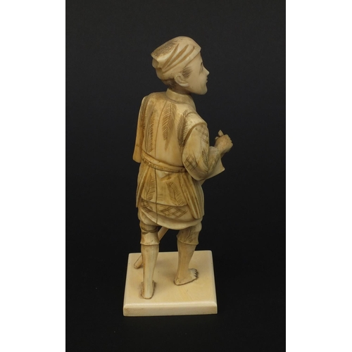 606 - Oriental Japanese ivory okimono figure of a gentleman with a stick, 15.5cm high