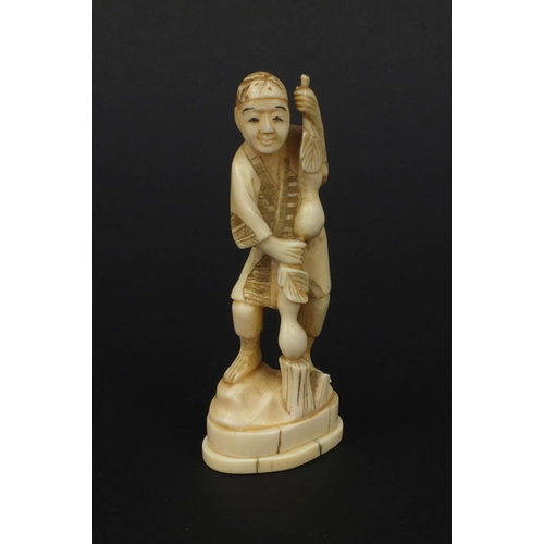 610 - Oriental Japanese ivory okimono of a gentleman with fruit, 12.5cm high