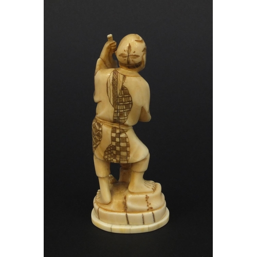 610 - Oriental Japanese ivory okimono of a gentleman with fruit, 12.5cm high