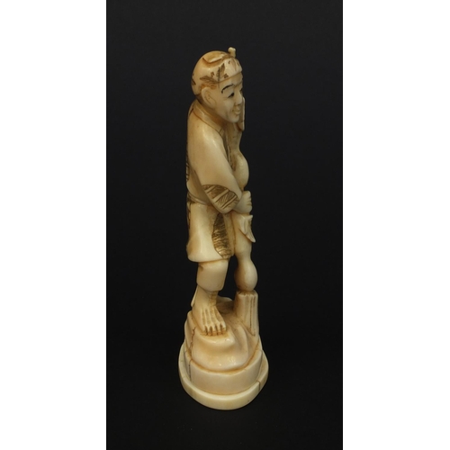 610 - Oriental Japanese ivory okimono of a gentleman with fruit, 12.5cm high