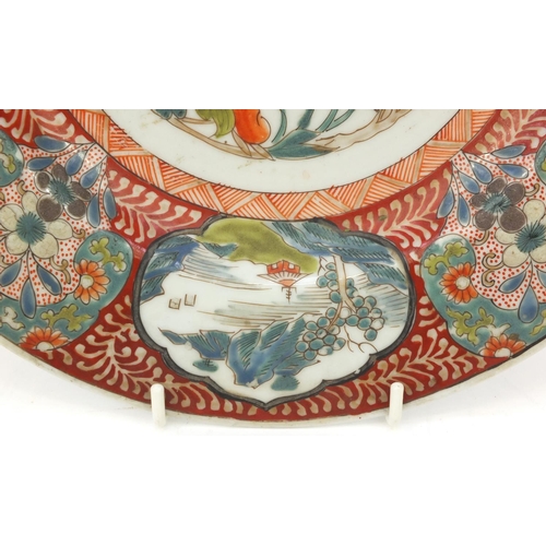 591 - Oriental Japanese shallow dish hand painted with birds and houses, character marks to the base, 27cm... 