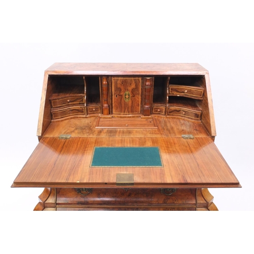 2008 - Dutch burr walnut Bombe bureau the fall inclosing a fitted interior about three curved drawers, 101c... 