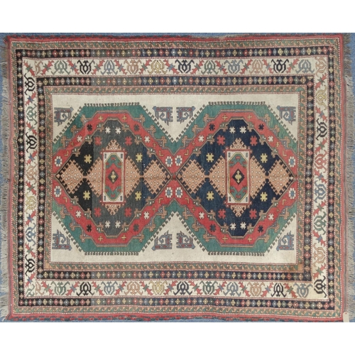 2035 - Rectangular Middle Eastern geometric patterned rug, the border with stylised motifs, the central fie... 