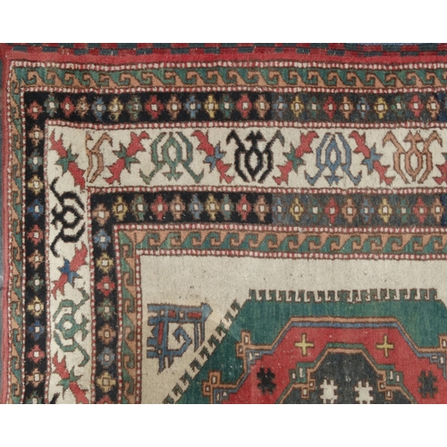 2035 - Rectangular Middle Eastern geometric patterned rug, the border with stylised motifs, the central fie... 