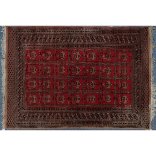 2009 - Rectangular Middle Eastern rug with geometric border, the central field decorated with a continuous ... 