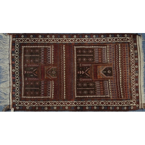 2042 - Rectangular Middle Eastern prayer mat with geometric and floral border, the central field decorated ... 