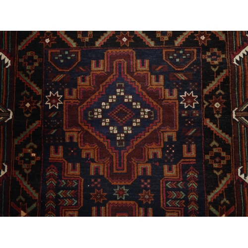 2039 - Rectangular Afghan wall rug with oriental N.F.C. Carpets label, the border and central field with ge... 