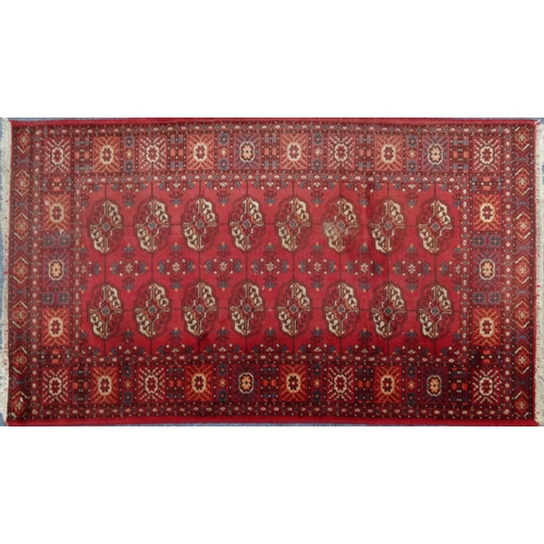 2041 - Rectangular Middle Eastern rug with geometric border and the central field with floral decoration on... 