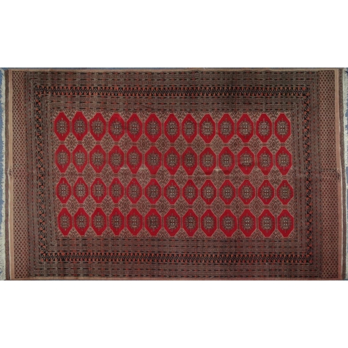 2004 - Large rectangular Middle Eastern carpet with geometric border, the central field decorated with a co... 
