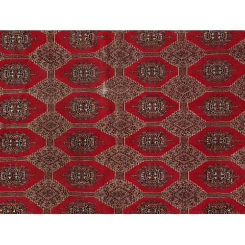 2004 - Large rectangular Middle Eastern carpet with geometric border, the central field decorated with a co... 