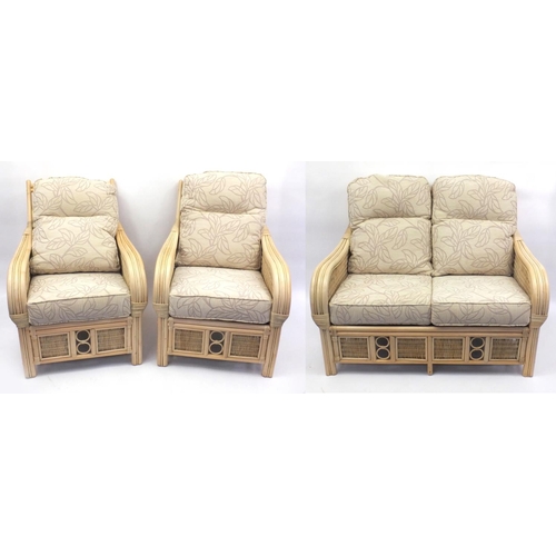 2014 - Good quality cane three piece conservatory suite with contempary beige floral cushions, the settee 1... 