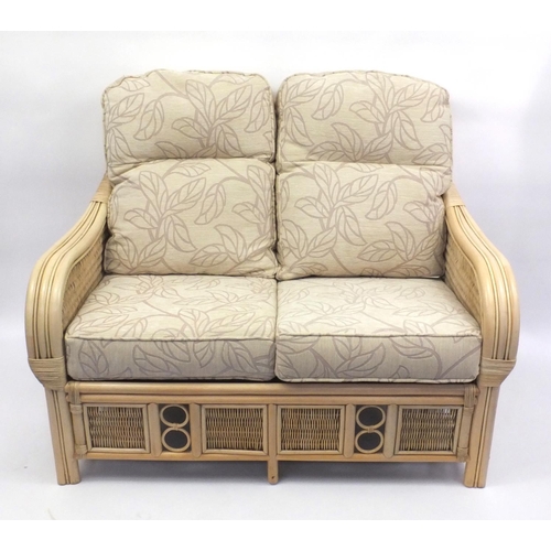 2014 - Good quality cane three piece conservatory suite with contempary beige floral cushions, the settee 1... 
