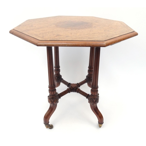 39 - Carved walnut octagonal occasional table with inlaid top, 62cm high x 61cm diameter