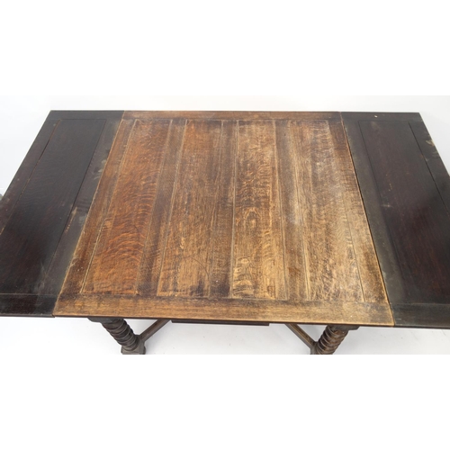 57 - Oak drawleaf dining table with barleytwist legs, 73cm high x 106cm square