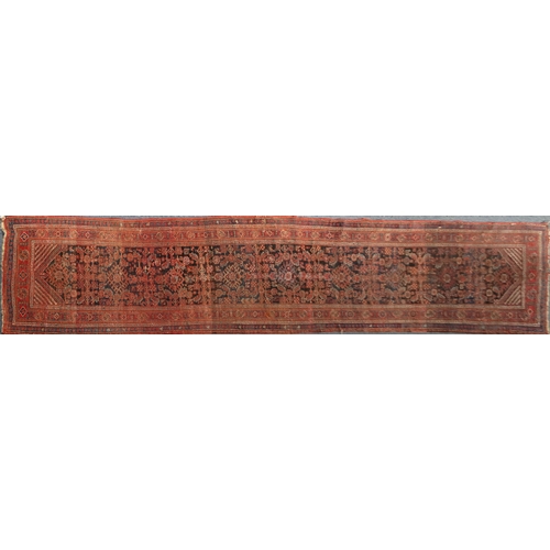 2027a - Middle eastern carpet runner with geometric boarder, the central field with a repeated geometric pat... 