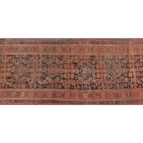 2027a - Middle eastern carpet runner with geometric boarder, the central field with a repeated geometric pat... 