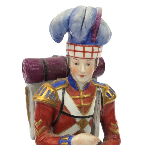 2118 - Hand painted military interest porcelain figure of a the 11th Highland Rg.1808, factory marks to the... 