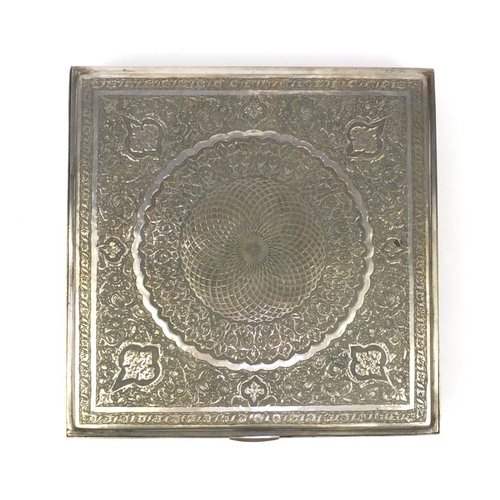 298 - Square Middle Eastern silver coloured metal box, the hinged lid with floral chased decoration, prese... 