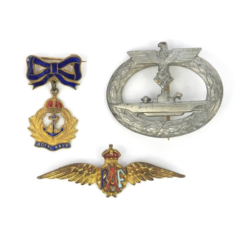 380 - Three military interest badges including a German military interest U-boat badge an enamelled RAF ba... 