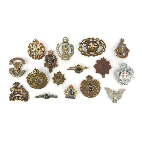 377 - Group of Military interest cap badges and brooches including a silver and enamel 'Inns of court' bro... 