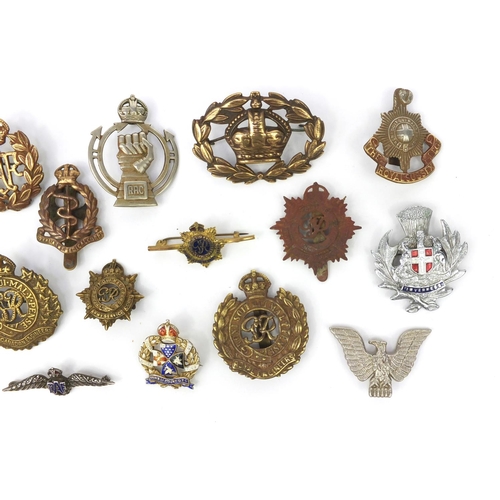 377 - Group of Military interest cap badges and brooches including a silver and enamel 'Inns of court' bro... 