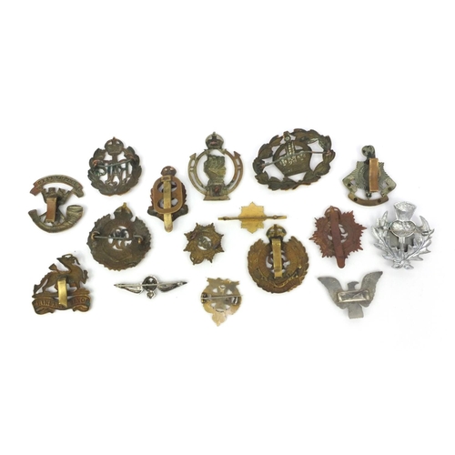 377 - Group of Military interest cap badges and brooches including a silver and enamel 'Inns of court' bro... 