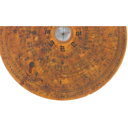 550 - Chinese wooden geomantic compass and perpetual calendar, character marks to the base, 16cm in diamet... 