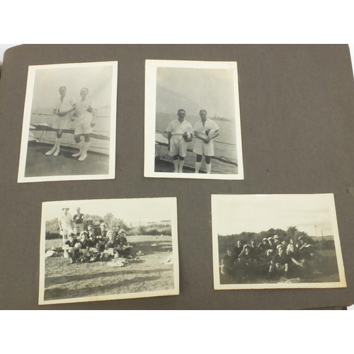 212 - Group of military interest photographs including an album with views of ships, wreckages, soldiers i... 
