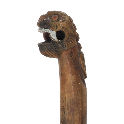 513 - Chinese carved wooden walking stick with the pommel in the form of a mythical beast, 87cm long