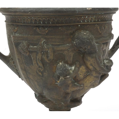 37 - Pair of brass twin handled urns both embossed with classical scenes, both with liners, each 16cm hig... 
